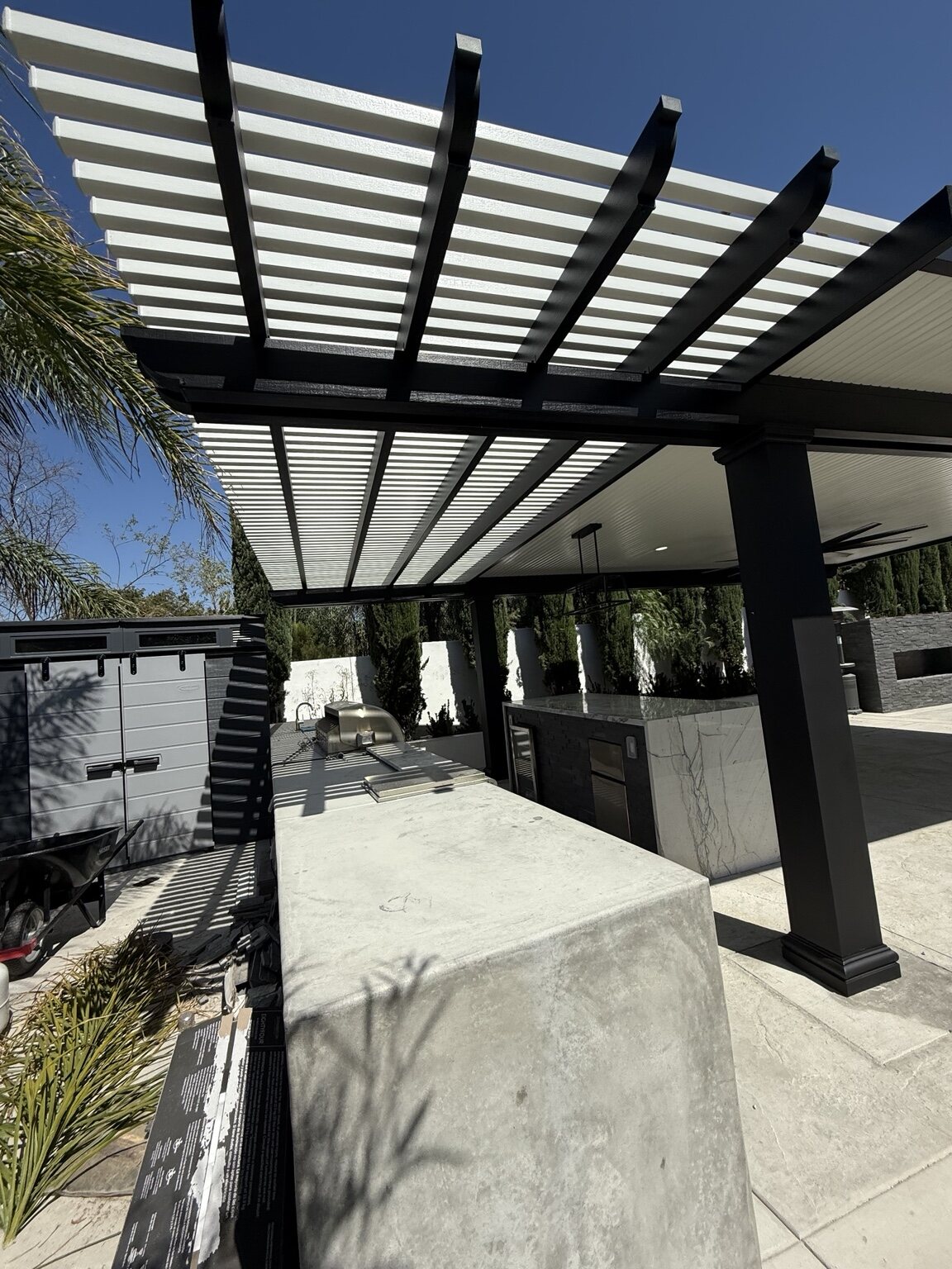 Black and white lattice patio cover detail by Total Patio